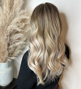 Blonde woman with long blended ombre hair